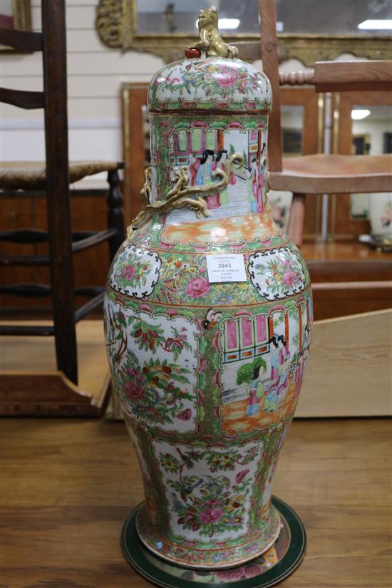 A pair of large 19th century Chinese famille rose vases and cover, 67.5cm high, repaired